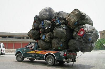 Truck hauling WAY too much garbage