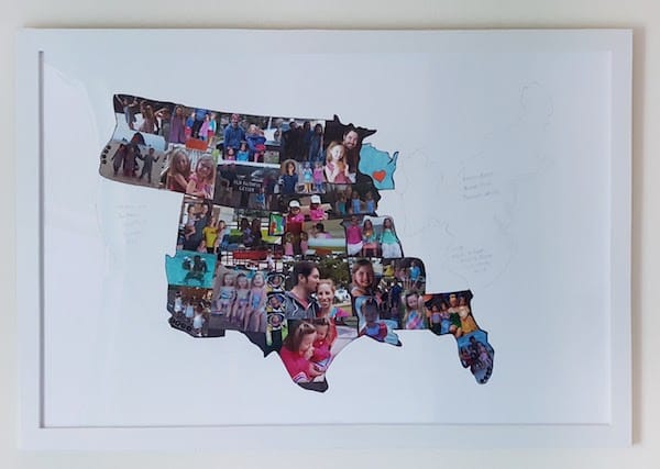 Posterboard with US States outlines. States we've visited are filled in with pictures from that portion of our trip