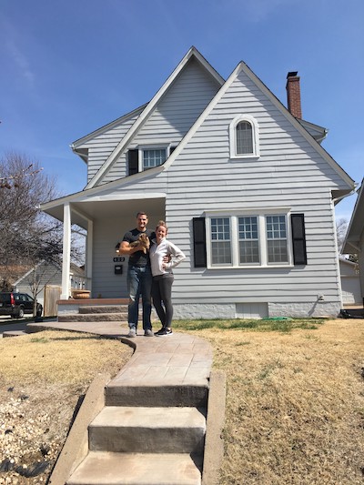 Sarah and Marc in front of their home in Kansas