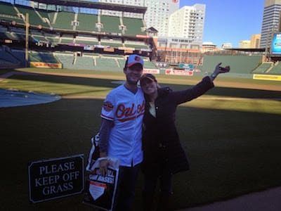 Andrew and Annelise at a baseball stadium