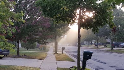 Beautiful suburban street with sunrise