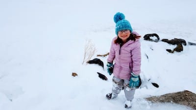 One of our twins playing in the snow in APRIL