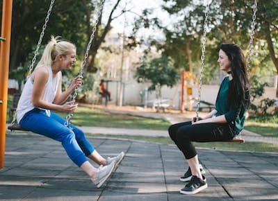 Friends on swings