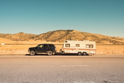 Pickup truck and camping trailer on the side of the road