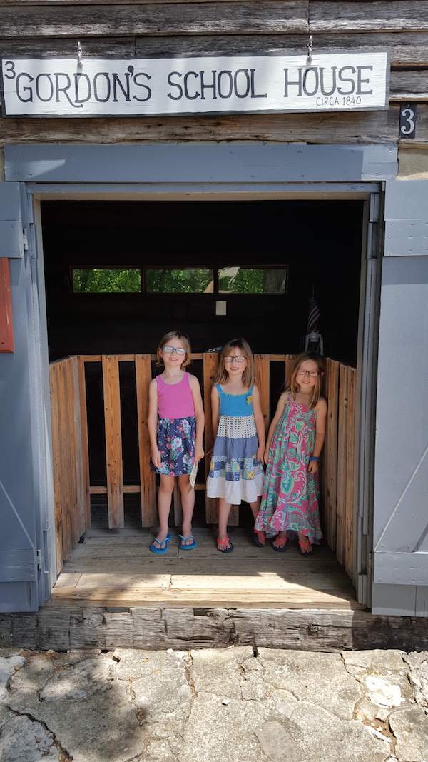 Our daughters in the doorway of the Cannonsburgh Village Schoolhouse in Murfreesboro, TN
