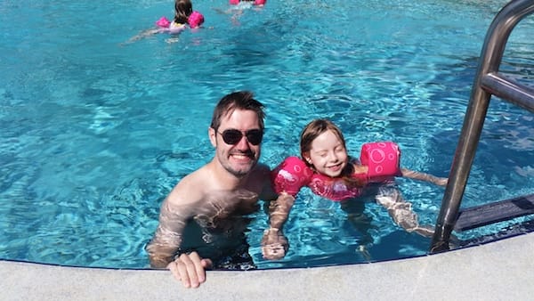 Chris and one of our daughters in the pool