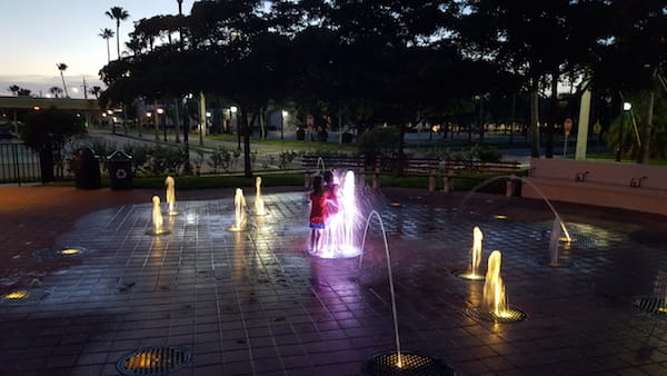 Playing at the splash pad in downtown Venice, FL