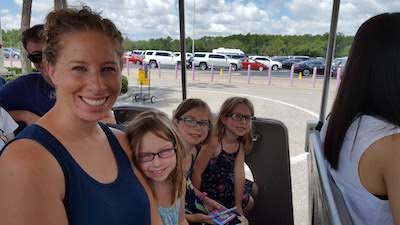 Jaime and the girls in the parking lot tram at Disney World