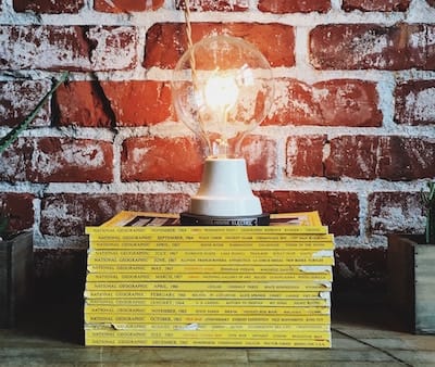 Lamp on top of a stack of 'National Geographic' magazines