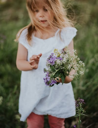 Girl holding flowers