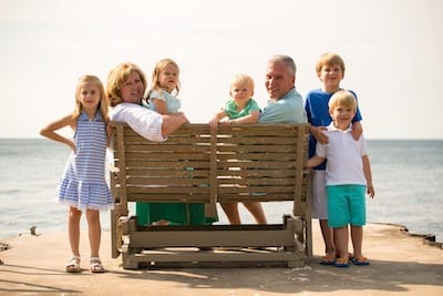 Jen, Tom, and grandkids by the water