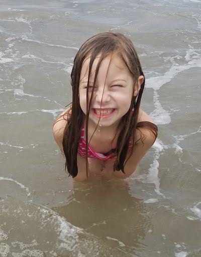 A in the ocean with a HUGE smile