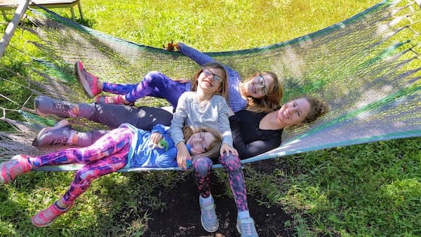 Jaime and the girls cuddling in a hammock